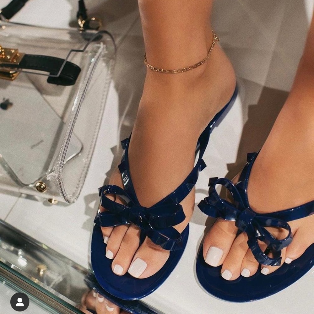 Navy blue jelly sandals with rock studs
